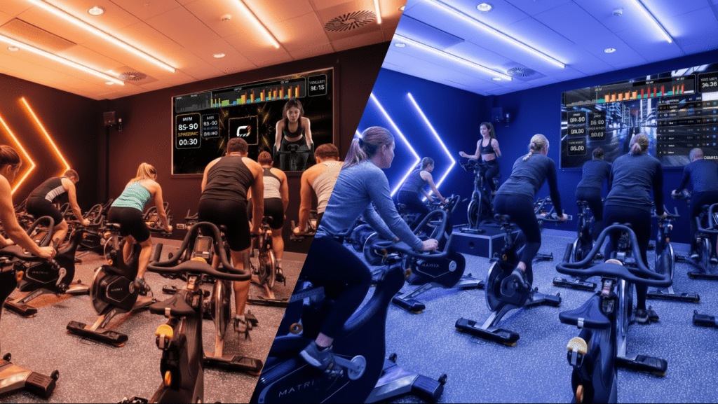 A split image of one indoor cycling studio. On the left, riders follow a virtual class led by an instructor on the studio screen. On the right, a live instructor leads the room from a podium bike at the front.